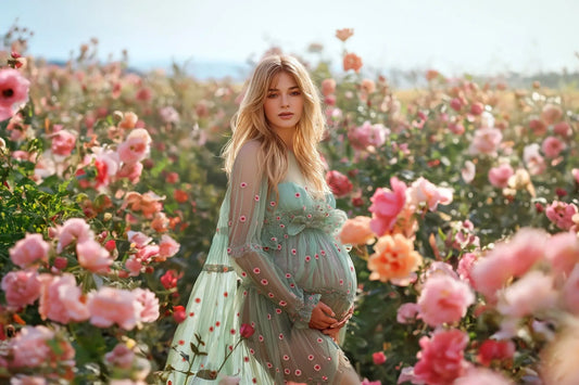 Pregnant woman in floral dress standing in a rose field – blog cover for beginner's guide to using digital backdrops in Photoshop