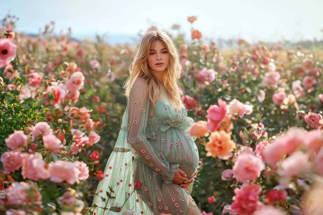 Pregnant woman in floral dress standing in a rose field – blog cover for beginner's guide to using digital backdrops in Photoshop