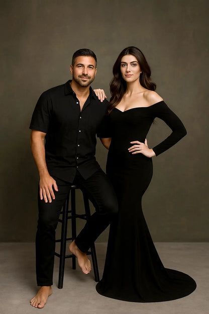 Man and woman in formal attire posing against a brown background